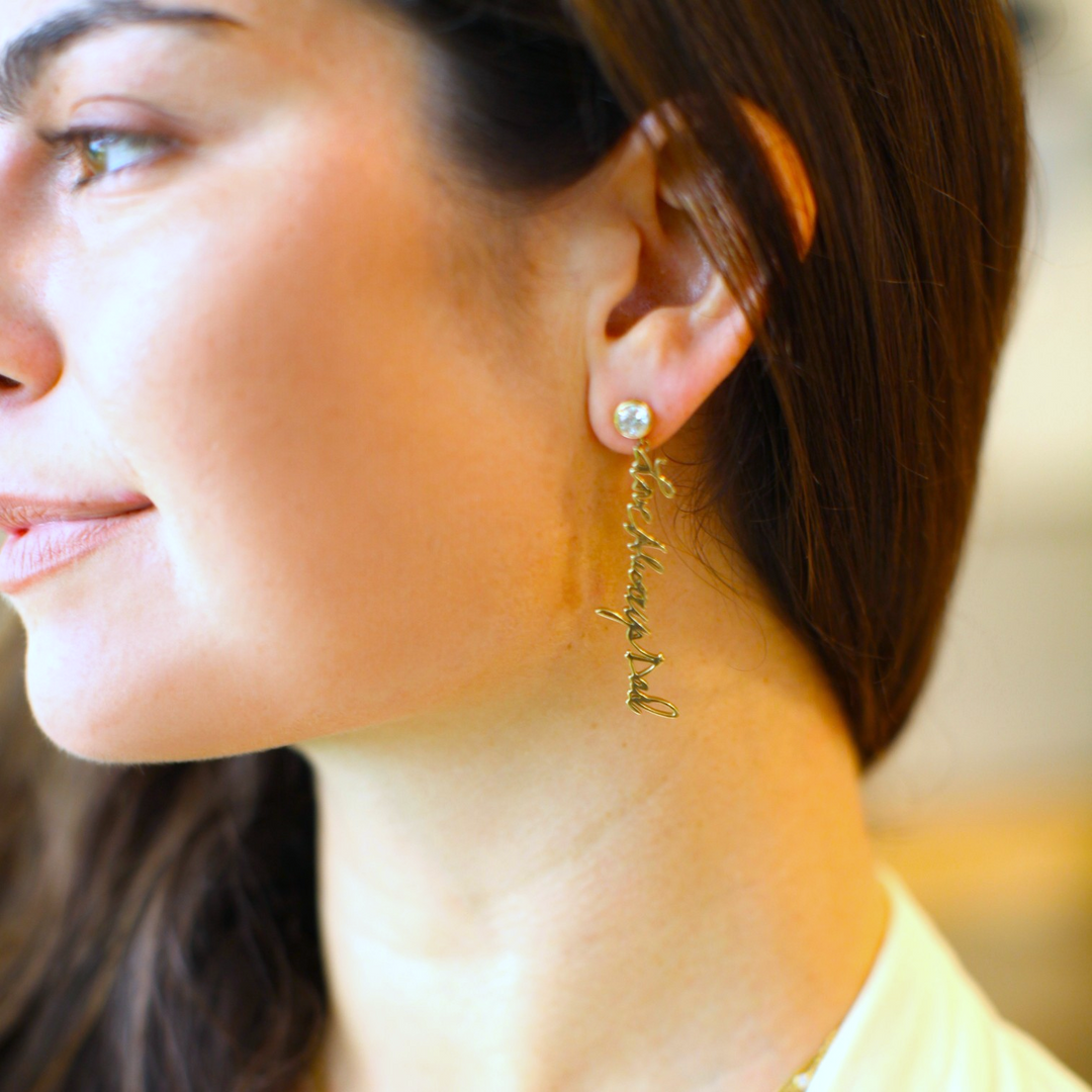 Your handwritten words gleam from ear to ear,
Your message in gold forever to hear 

Your handwritten earrings in thick 14K gold dangle from sparkling half carat diamond studs