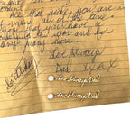 Handwritten earrings in thick 14K gold dangle from sparkling half carat diamond studs