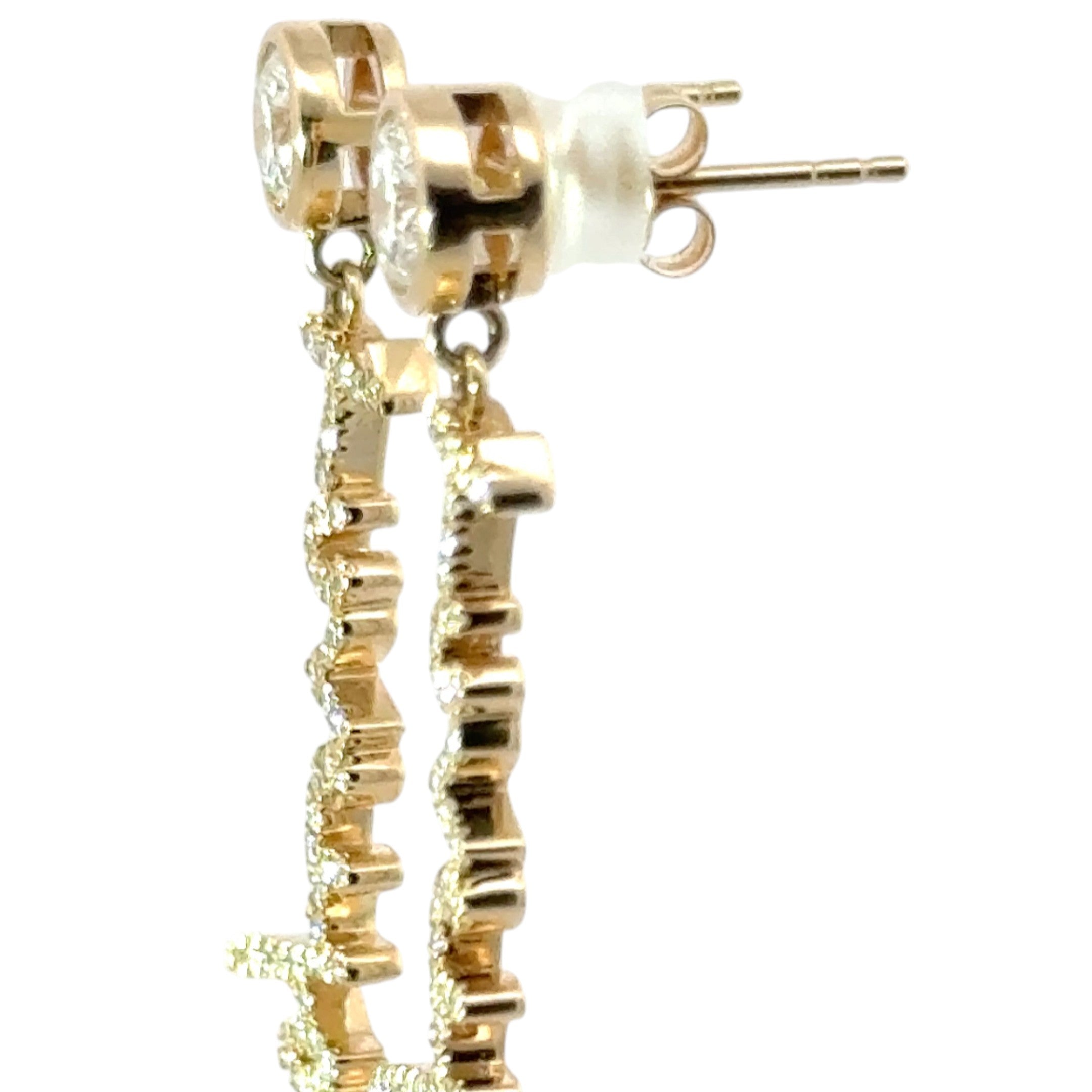 Your unique handwritten earrings in thick 14K gold, encrusted in pave diamonds, dangle from sparkling half carat diamond studs