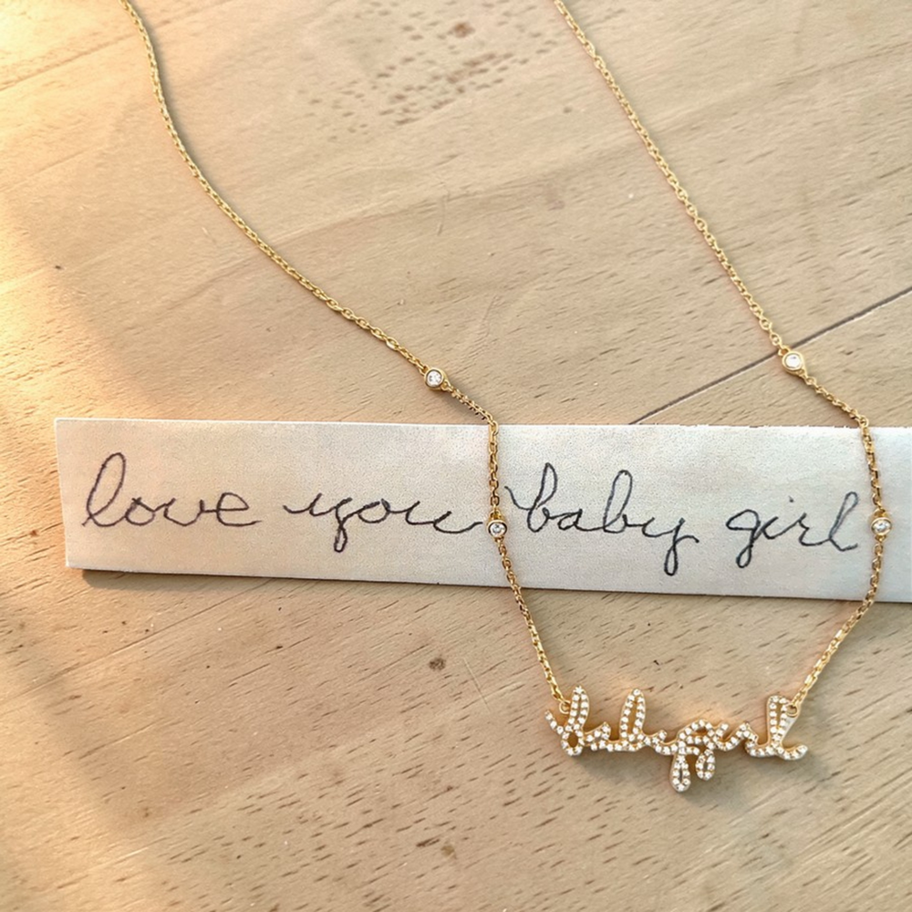 Your handwritten words rest close to the heart,
To gaze upon and to hold when you are apart

Your unique handwritten necklace in thick 14K gold, encrusted in pave diamonds, on an adjustable 18" diamond-cut chain featuring four sparkling bezel-set diamonds