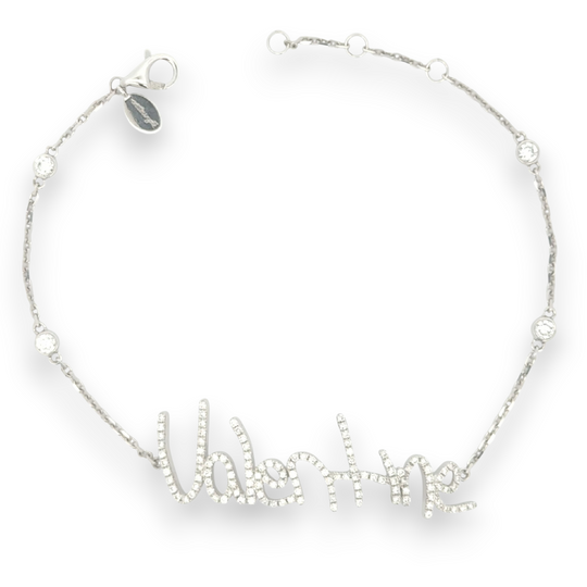 Your handwritten words worn delicately on the wrist,
There to clutch when you are most missed

Your unique handwritten bracelet in thick 14K gold, encrusted in pave diamonds, on an adjustable 7" diamond-cut chain featuring four sparkling bezel-set diamonds