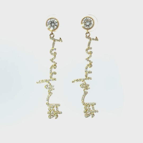 Your handwritten words gleam from ear to ear,
Your message in gold forever to hear

Your unique handwritten earrings in thick 14K gold, encrusted in pave diamonds, dangle from sparkling half carat diamond studs