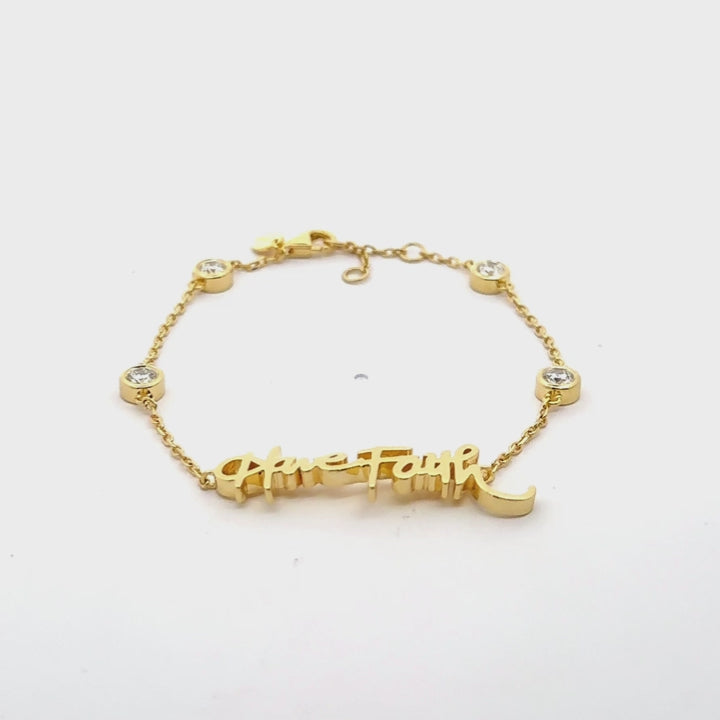 Your handwritten words worn delicately on the wrist,
There to clutch when you are most missed

14K yellow, white or rose gold
2mm thick
1.3mm diamond-cut chain w/ adjustable loops for 6, 6.5 &amp;amp; 7 inch length
Four ethically-sourced, bezel-set round diamonds (total weight: ~0.64 cts)
Pendant height and length vary by piece, and will be approved by you prior to crafting